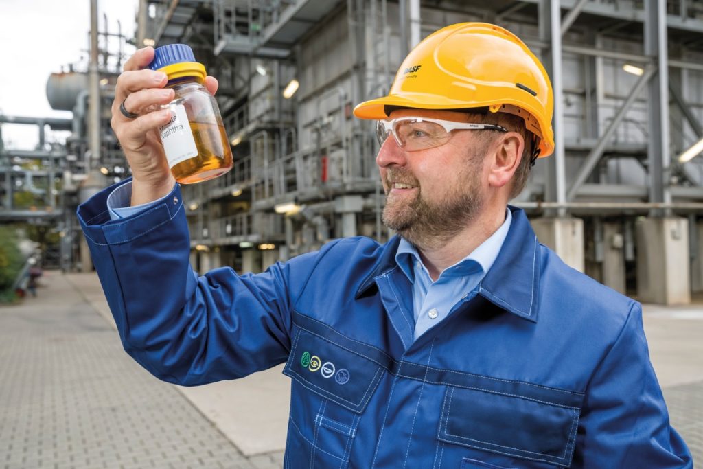 Dr. Andreas Kicherer with a sample of pyrolysis oil from plastic waste in front of the Steamcracker. Andreas Kicherer, Sustainability Strategy, with a bottle of pyrolysis oil recovered from plastic waste.BASF's ChemCycling project focuses on recycling plastic waste in chemical production rather than disposing of it. Plastic waste is converted into new raw materials by thermo-chemical processes and fed into the BASF Verbund in place of fossil resources. The resulting new chemical products have the same quality as products from fossil raw materials.