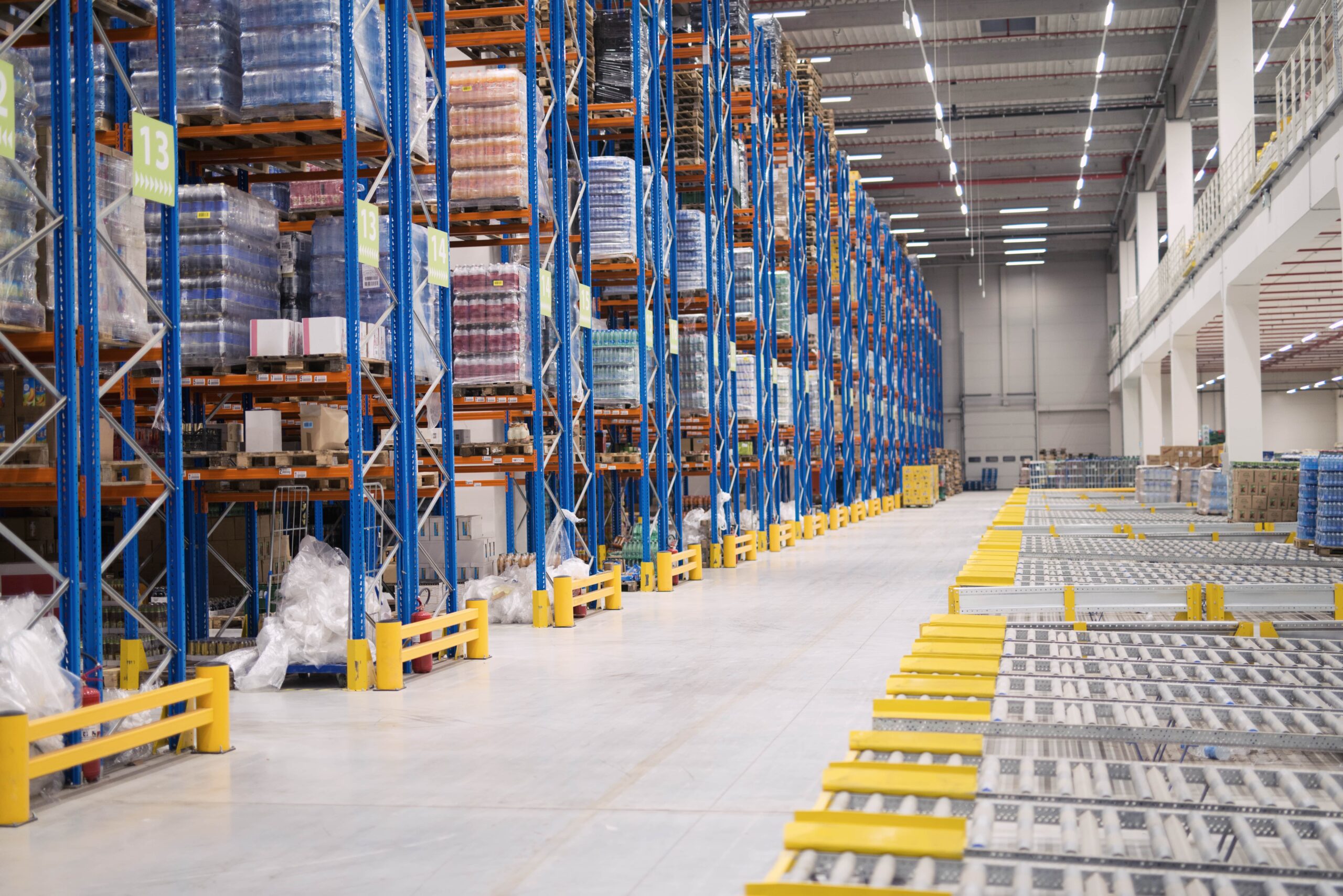 warehouse-storage-interior-with-shelves-loaded-with-goods-min-scaled