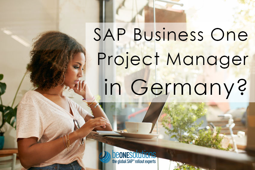 Young black female at cafe using laptop. African young woman sitting in a restaurant busy working on her laptop. Be one solutions SAP Business One Project Manager in Germany