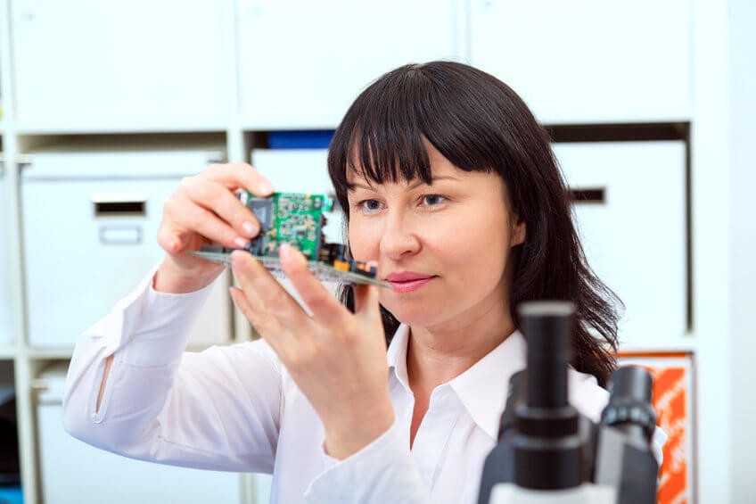 woman holding electronic microprocessor
