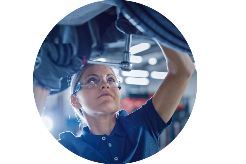 woman automotive service technician fixing a car