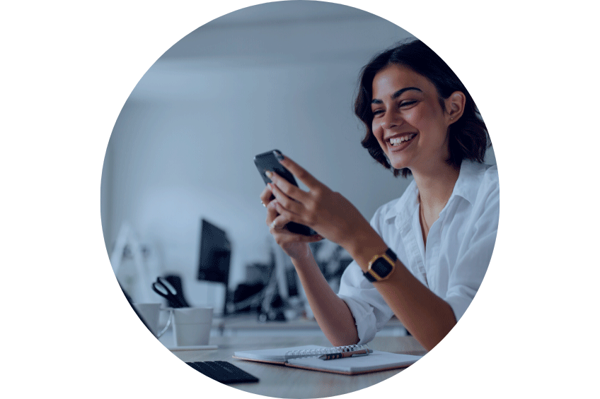 women smiling dialing on a phone