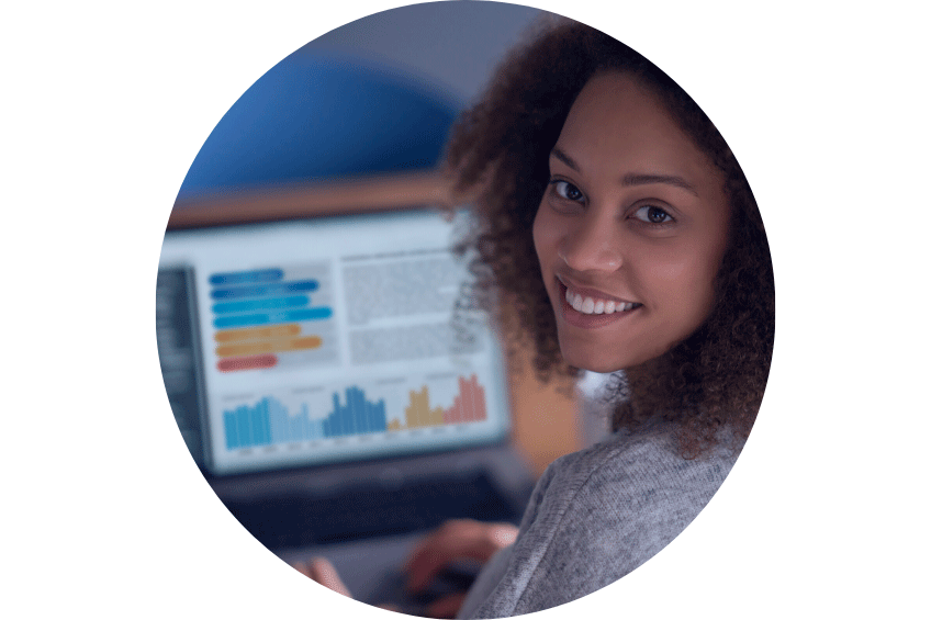 woman smiling at work with computer